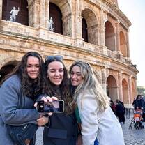 Students taking selfie in front of roman forum 