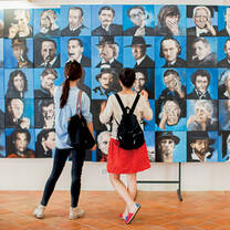 Two students view art.