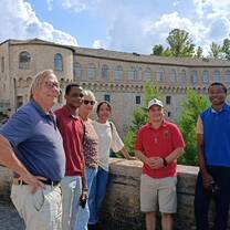 Students with the renowned Ducal Palace of Urbania in the background