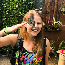 Student with butterfly in Ecuador