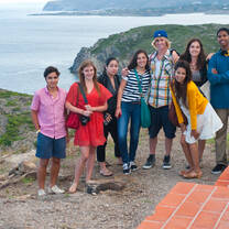 Group of students pose for photo on coast of Spain