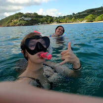 Students snorkeling in waters near Antigua