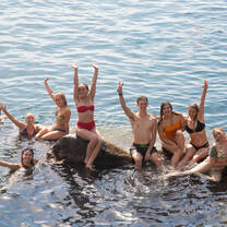 Students enjoying a sunny day by the Italian beach during their summer study abroad program.