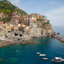 Wide shot of Cinque Terre’s colorful coastal villages visited during the study abroad program in Italy.