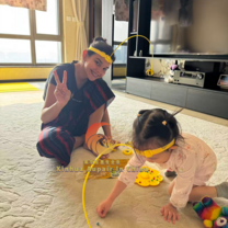 Au pair playing with host kid