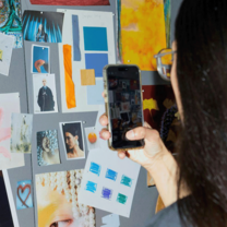 Student taking photo of mood board