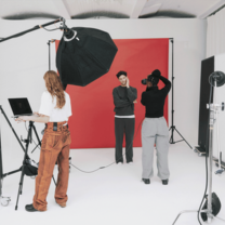 Students in studio conducting a photo shoot