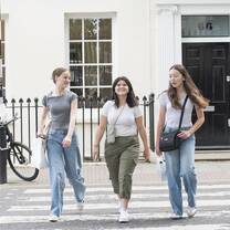 Students walking across the street in London