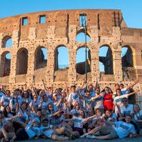 Group of students posing together in front of the Colosseum in Rome during a study abroad experience.
