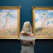 Student viewing Woman with a Parasol by Claude Monet at the Musée d’Orsay in Paris