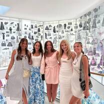 Students exploring La Galerie Dior museum and learning about the history of the Dior fashion house in Paris