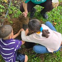 Volunteers and kids planting trees in Costa Rica