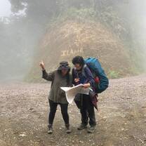 Volunteers trekking through a mountainous landscape in Costa Rica