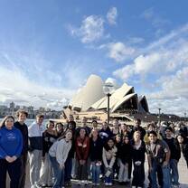 Group of teenagers posing in front of the Sydney opera house