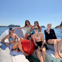 a group smiling on a boat