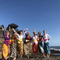 Students in traditional clothes on beach in Indonesia