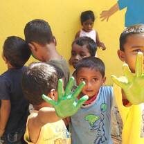 Kids helping paint the school