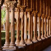 Row of decorated medieval columns in the Monreale Cathedral cloister, Sicily