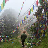 Trip Participant Walking at a Buddhist Monastery 