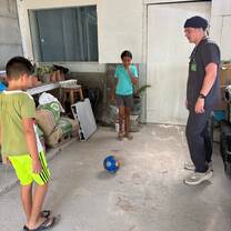 Playing soccer with the kids who lived at the house our clinic was at.