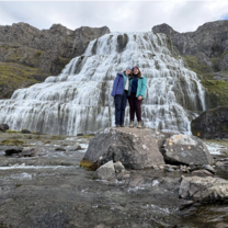Two SIT students in front of Dynjandi, the largest waterfall in the Icelandic Westfjords
