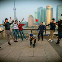 group of interns jumping in shanghai