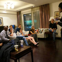 students taking a chinese course in their apartment