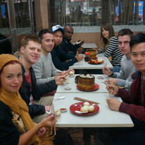 group of interns out to breakfast eating chinese dumplings