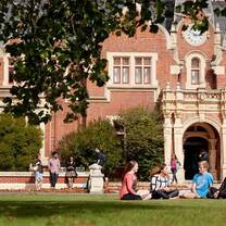 students sitting on lawn