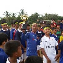 Volunteer football coach with Cambodian children
