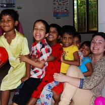 Volunteer playing with the children in India